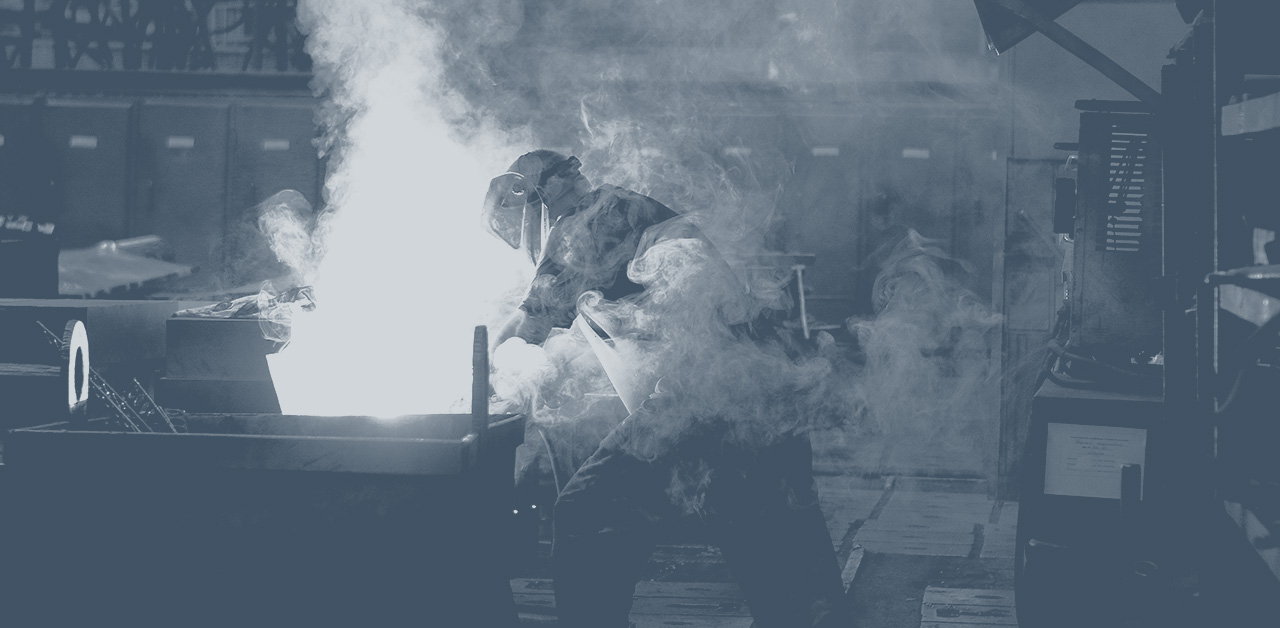 A photo of a person welding.